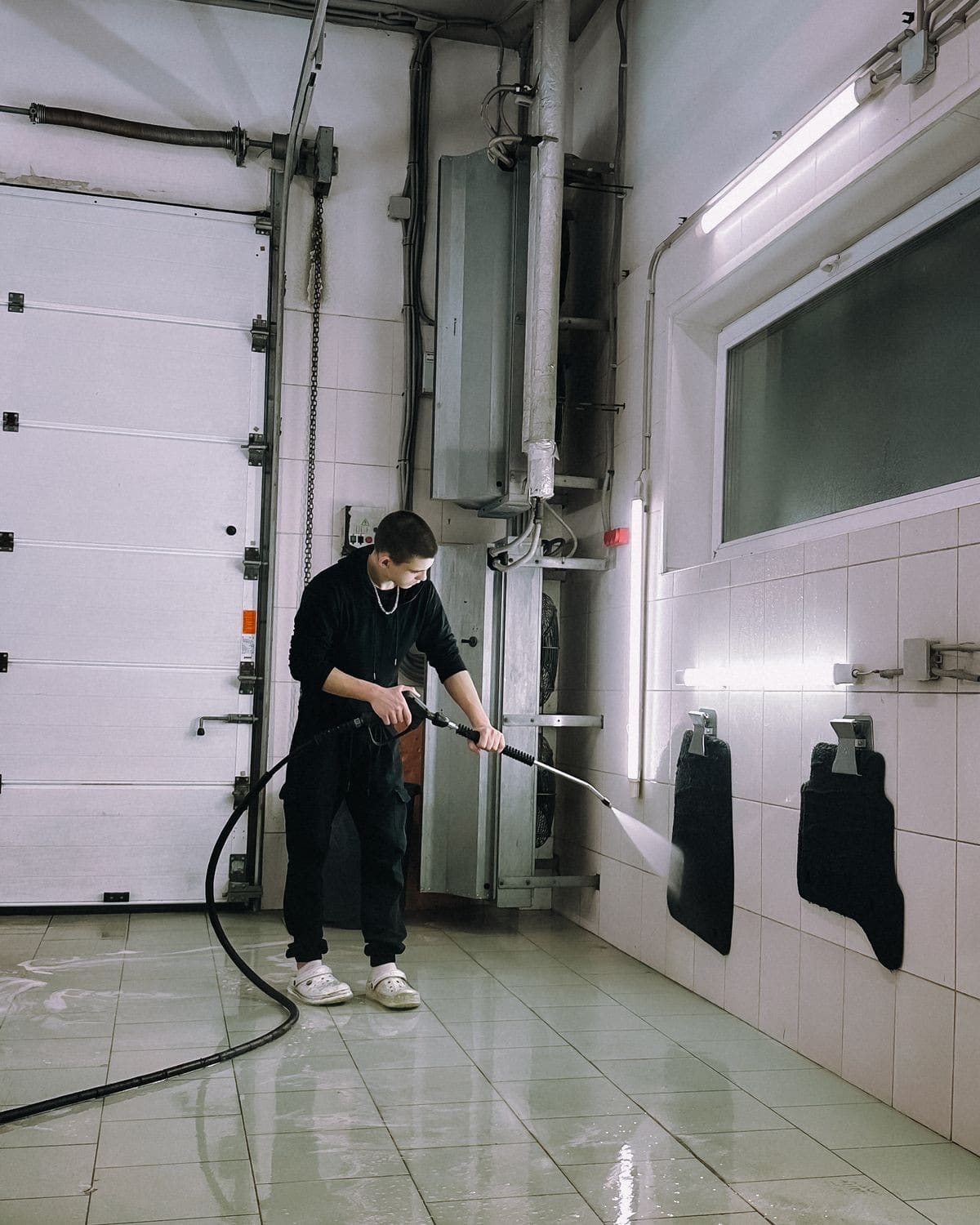 Stock photo: Worker using a pressure washer
