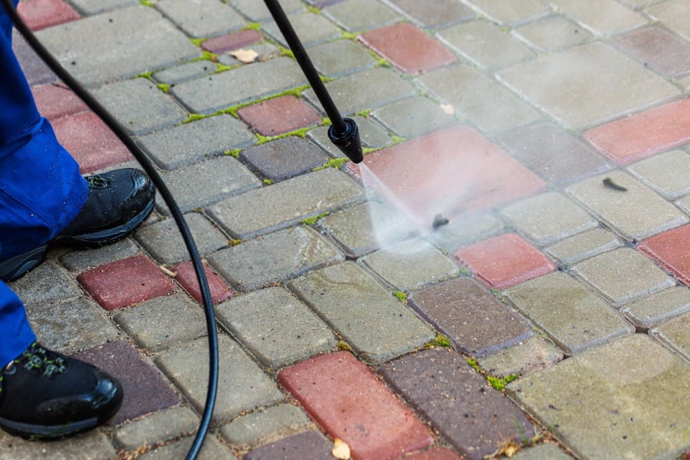 Stock photo: Pressure washing block paving